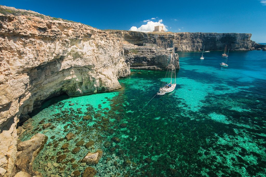 Image of a yacht in a Blue Lagoon in the island of Comino, Malta